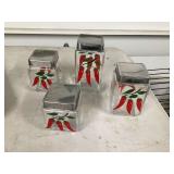 Set of 4 glass chili pepper canistersWater hose on reel with missing end