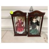 Two porcelain dolls with glass casesTools for yard maintenance