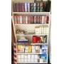 Wood shelving unit with contents. Includes new