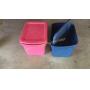 Pink And Blue Plastic Totes In The Garage