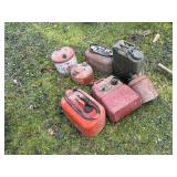 3 boat gas tanks 5 gas cans and 3 boat motors